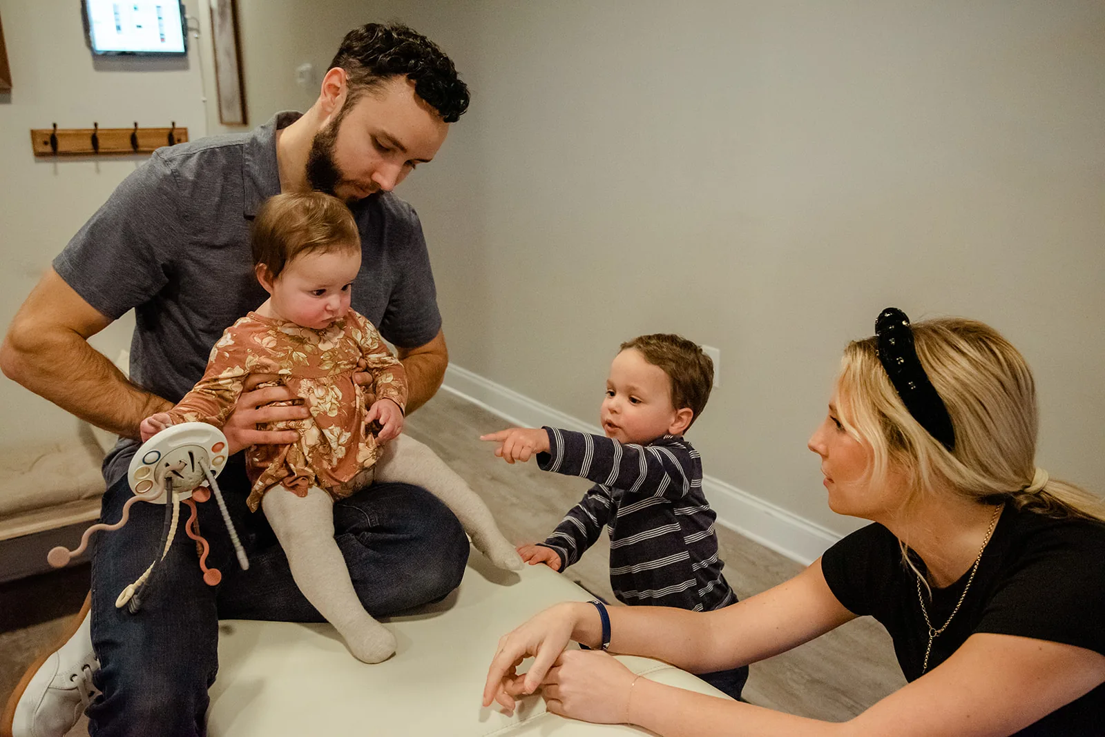 Doctor with family on clinic floor
