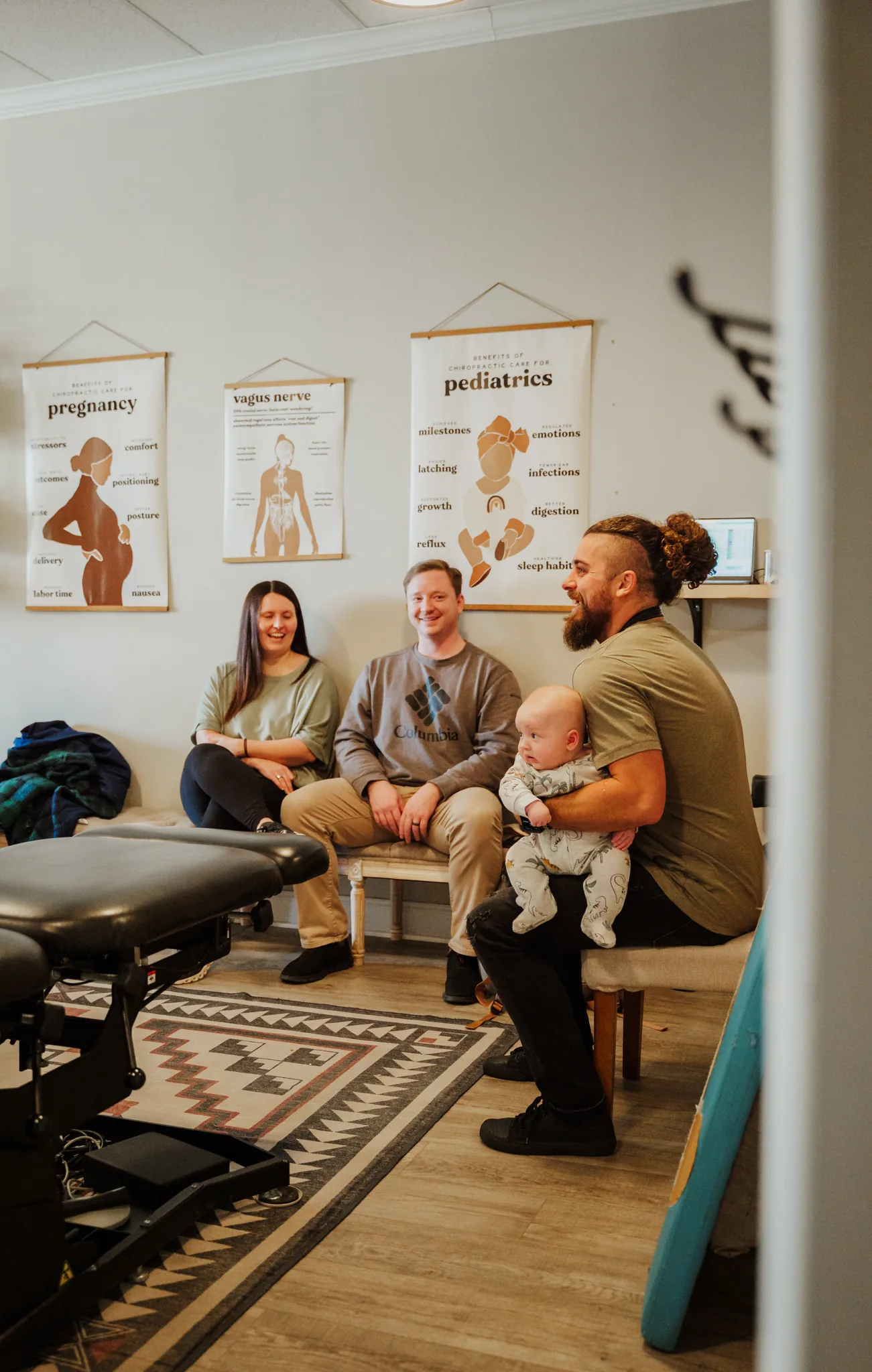 Doctor with baby and family