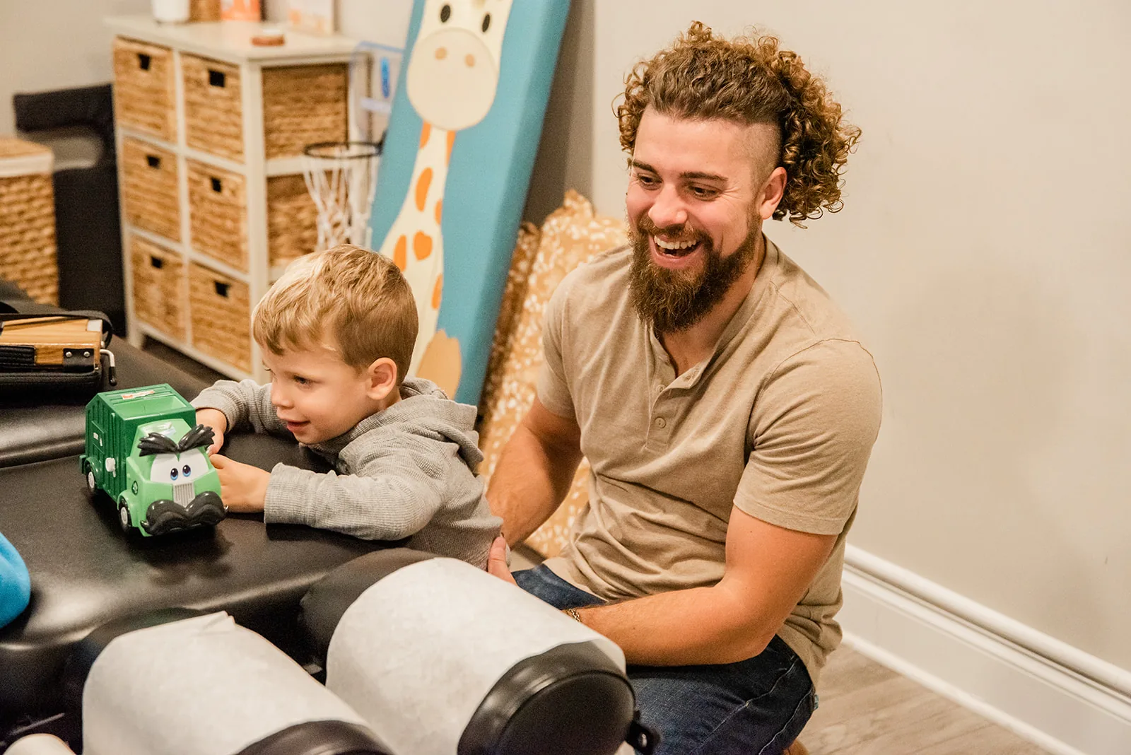 Doctor playing with toddler in clinic