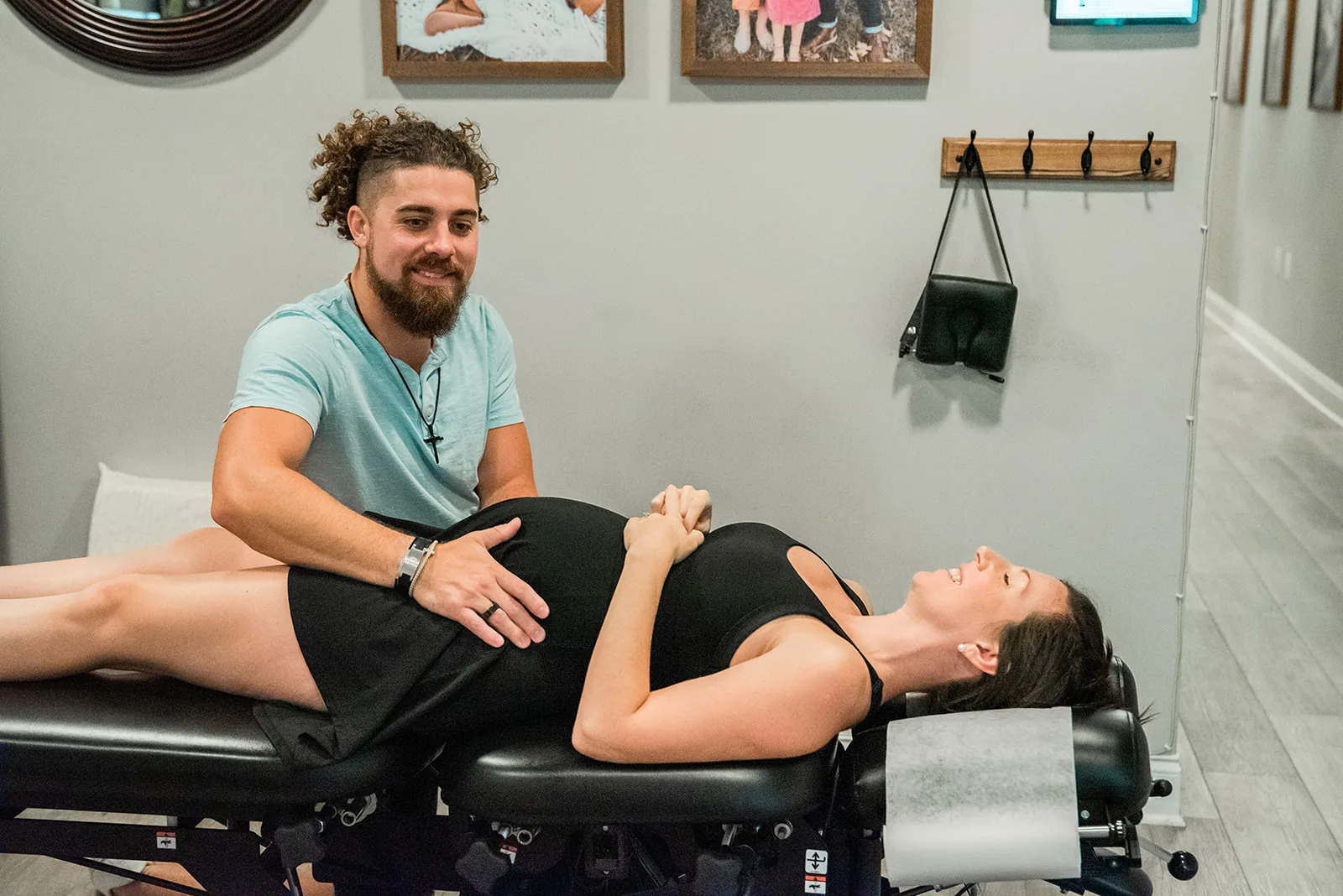 Prenatal chiropractic care - pregnant mom being adjusted